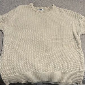 Cream colored sweater. Tunic length. Size XL.